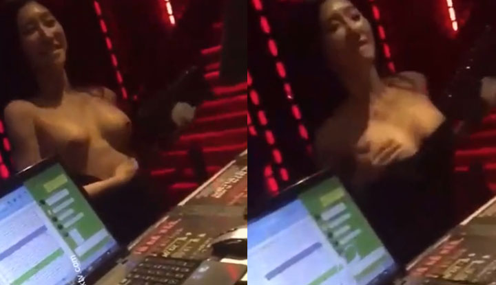 Scandalous events in the KTV room, where a young lady strips off her clothes and exposes her breasts in an attempt to seduce the DJ.