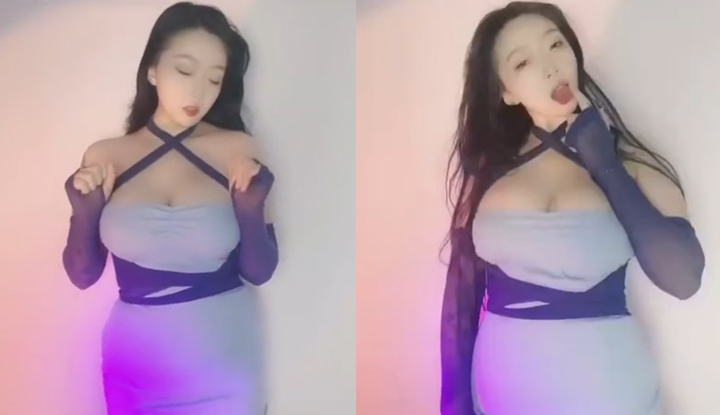 A irmã mais velha é bonita, tem uma aparência elegante e seios grandes. Ela usa uma blusa de mangas compridas com desenhos de personagens de desenho animado, que a deixa encantadora. Ela dança de forma encantadora.