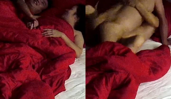 A married couple went on a trip together for business and they were deeply in love with each other in the hotel room in the middle of the night.