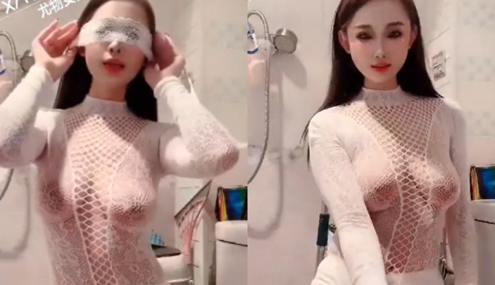 her eyes widened, revealing a hint of her large breasts in a steamy, sexy dance.