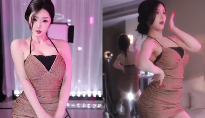 a sexy streamer shows off her curvy figure with daring, hot dance moves in front of the camera.