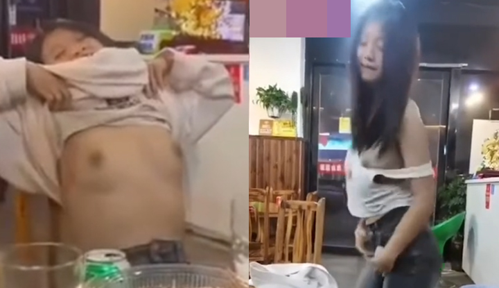 a hot, sexy girl flirts at a drinking table: pulling down her clothes to reveal her cleavage while seducing the opposite sex, performing a provocative and alluring dance, twisting her hips to expose her nipples. the photos are from a real location and are extremely vulgar and inappropriate!