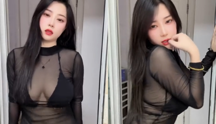 long-haired, big-breasted young woman dances seductively, her body partially obscured – so sexy!